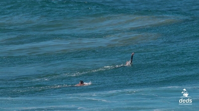 Waves at Vic Bay trap teen and dad