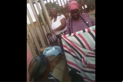 Nurse tells woman giving birth outside clinic to be quiet