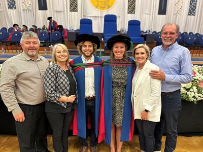 Two lovebirds graduate in formation