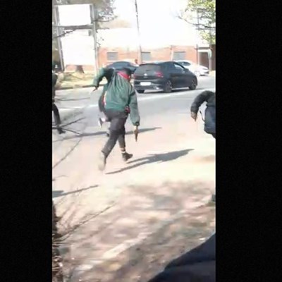 NW school boy chases after another boy with gun, as dad watches