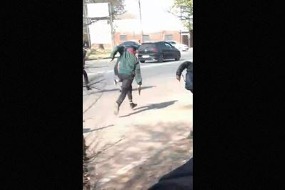 NW school boy chases after another boy with gun, as dad watches