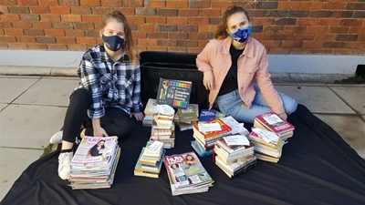 Learners donate to The Haven