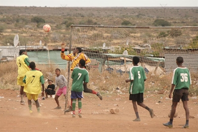 Playing a football friendly to keep fit