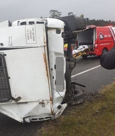 Bakkie carrying prisoner flips on N2