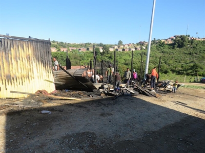Shock in wake of shop owner's flaming death
