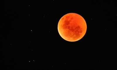 Skies open up to welcome blood moon