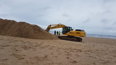 Preparations to breach river mouth