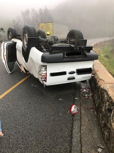 Vehicle overturns on pass
