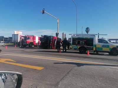 Firefighters injured as truck overturns