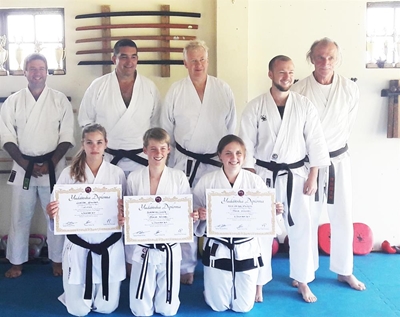 Karatekas pass senior and junior black belt exams