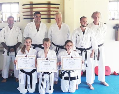 Karatekas pass senior and junior black belt exams