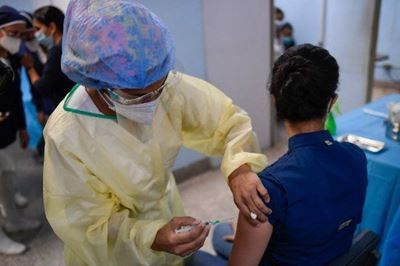 Covid vaccines block disease, but do they stop infection?