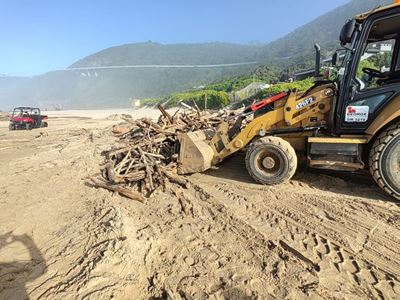 Convoy of trucks for clean-up operation after heavy rains