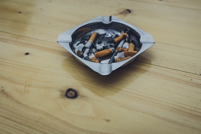 The cigarette ban is still only half-smoked