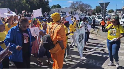 Marchers gather at court as murder suspect appears 