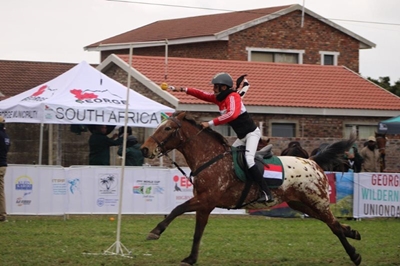 Slicing oranges with swords on horseback