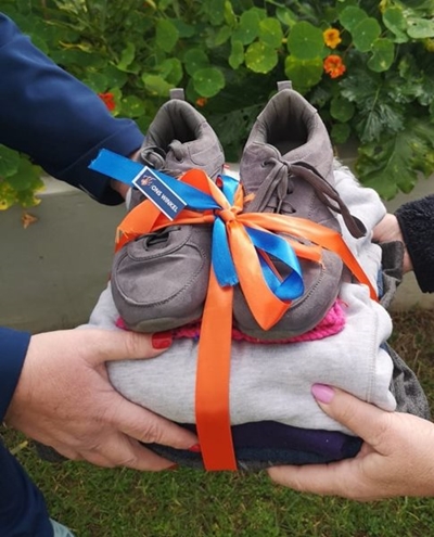 Liefdadigheidswinkels herdenk mylpaal met Dade van Hoop