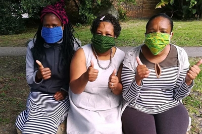 Life women make Shweshwe masks