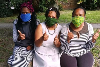 Life women make Shweshwe masks