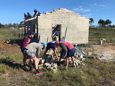 Learners help build home for fire victim