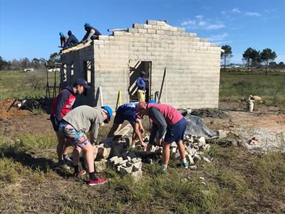 Learners help build home for fire victim