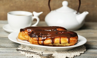 Homemade eclairs with chocolate drizzle