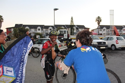 Tenacious cyclist secures 550 education packs