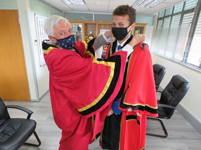 Ceremonial handover of a junior mayoral chain