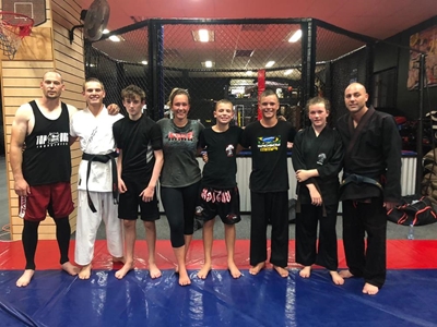 Fighters obtain their black belts