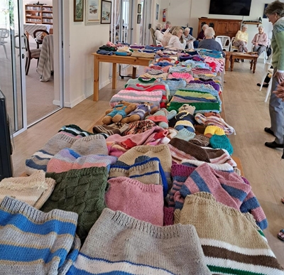 Knysna women knitting jerseys for youngsters