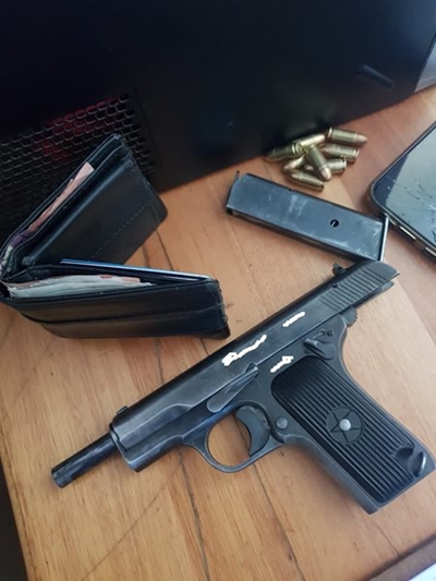 Three arrested with guns and drugs