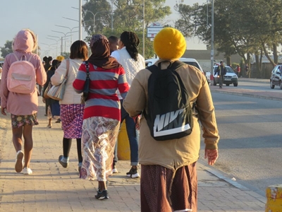 Stranded commuters walk to work