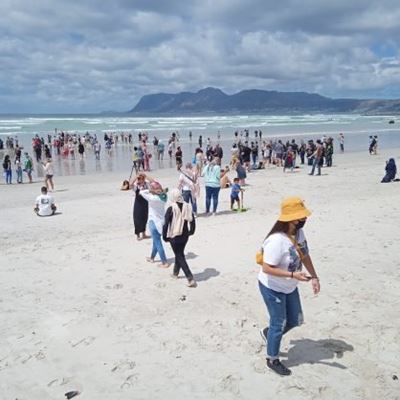 Protesters frolic at Muizenberg beach 