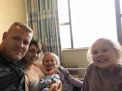 New baby arrives amid fire chaos