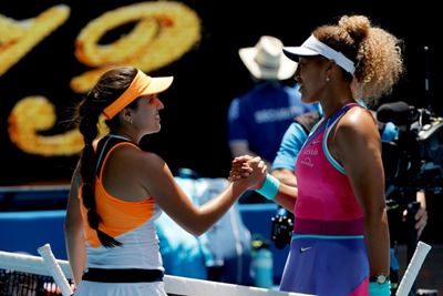 Osaka overcomes stumble to make Australian Open second round 