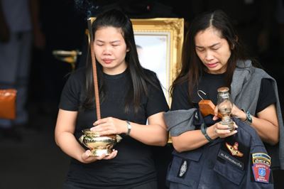 Thais mourn 29 killed in mass shooting 