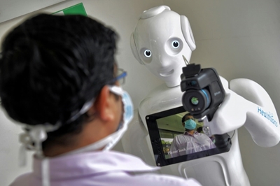 Robots: allies during virus crisis, enemies later?