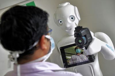 Robots: allies during virus crisis, enemies later?