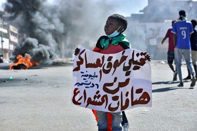 Sudan police fire tear gas as thousands protest