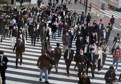 Japan on 'maximum alert' after record virus cases: PM