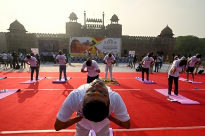 Free Covid vaccines for all Indian adults as Modi hails yoga 'shield'