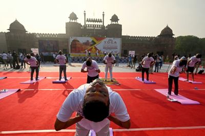 Free Covid vaccines for all Indian adults as Modi hails yoga 'shield'