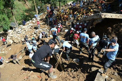 Grim search for typhoon landslide victims