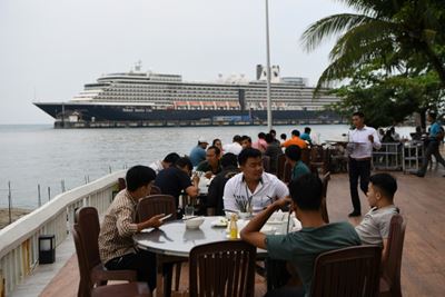 Elated passengers leave Cambodia cruise ship after virus all-clear