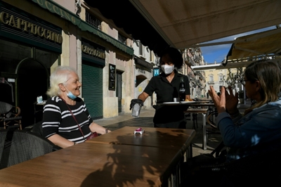 Outdoor terraces open as lockdown eases in much of Spain