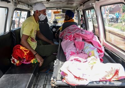 India bootleg alcohol death toll rises to 98 as families mourn