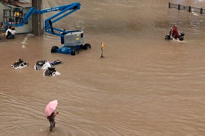 12 dead in flooded subway as downpours hit central China: officials