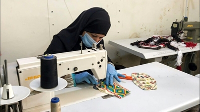 Women in Egypt's restive Sinai bring Bedouin embroidery to virus fight