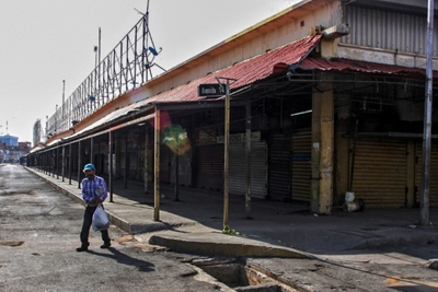 Spread through a market, coronavirus overwhelms Venezuelan oil hub