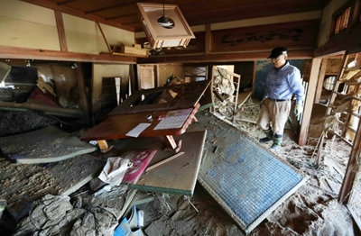 Survivors of deadly Japan floods face uncertain future